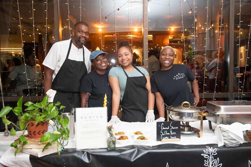 chefs smiling behind buffet table