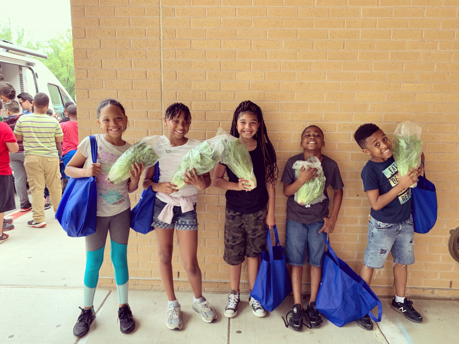 students with their salad kits from TWK